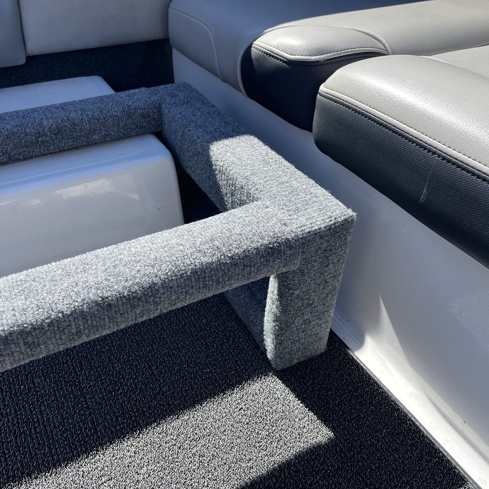 Close-up of the wrapped carpet corners on the seat base